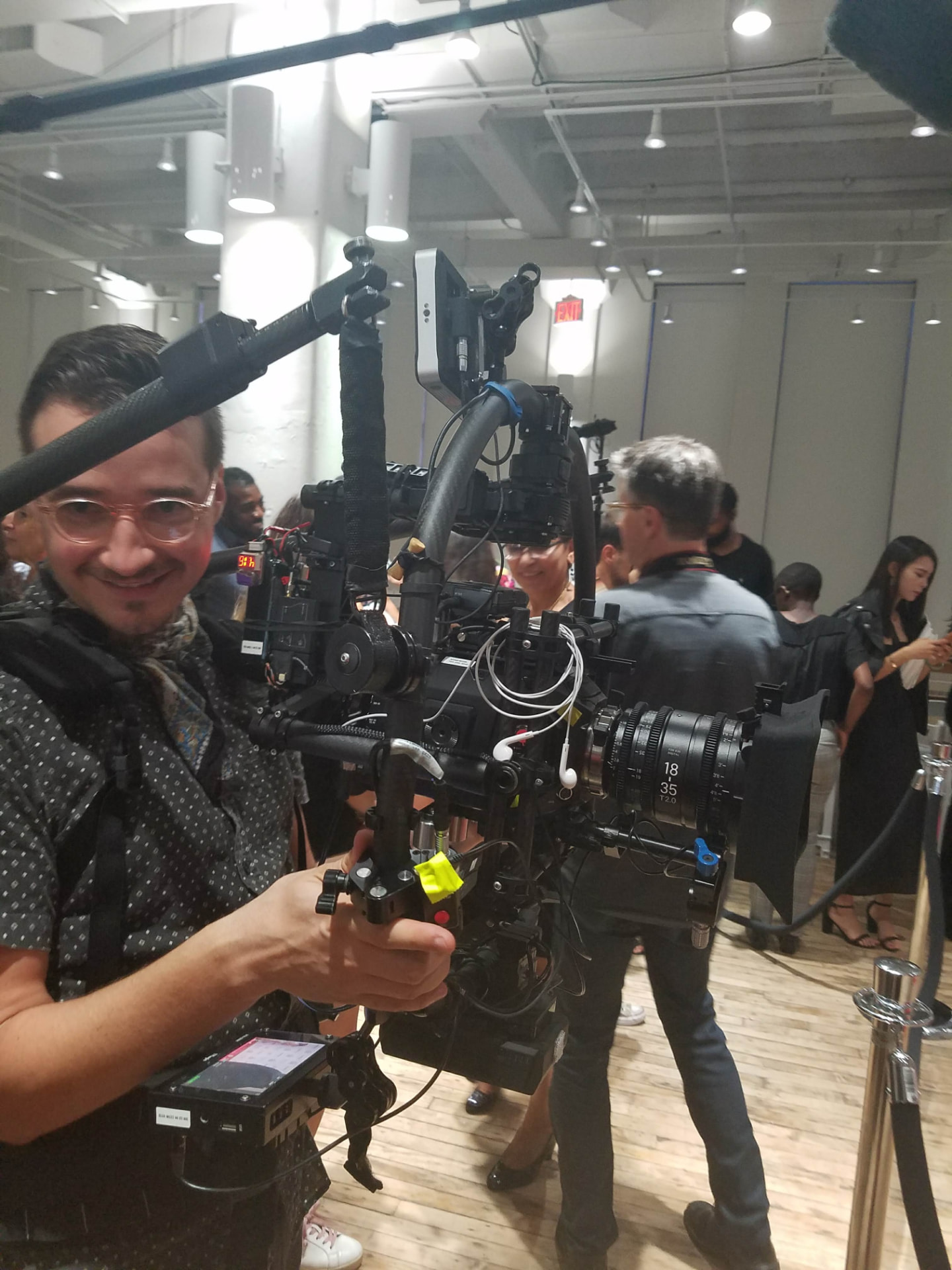 Camera operator filming at the event