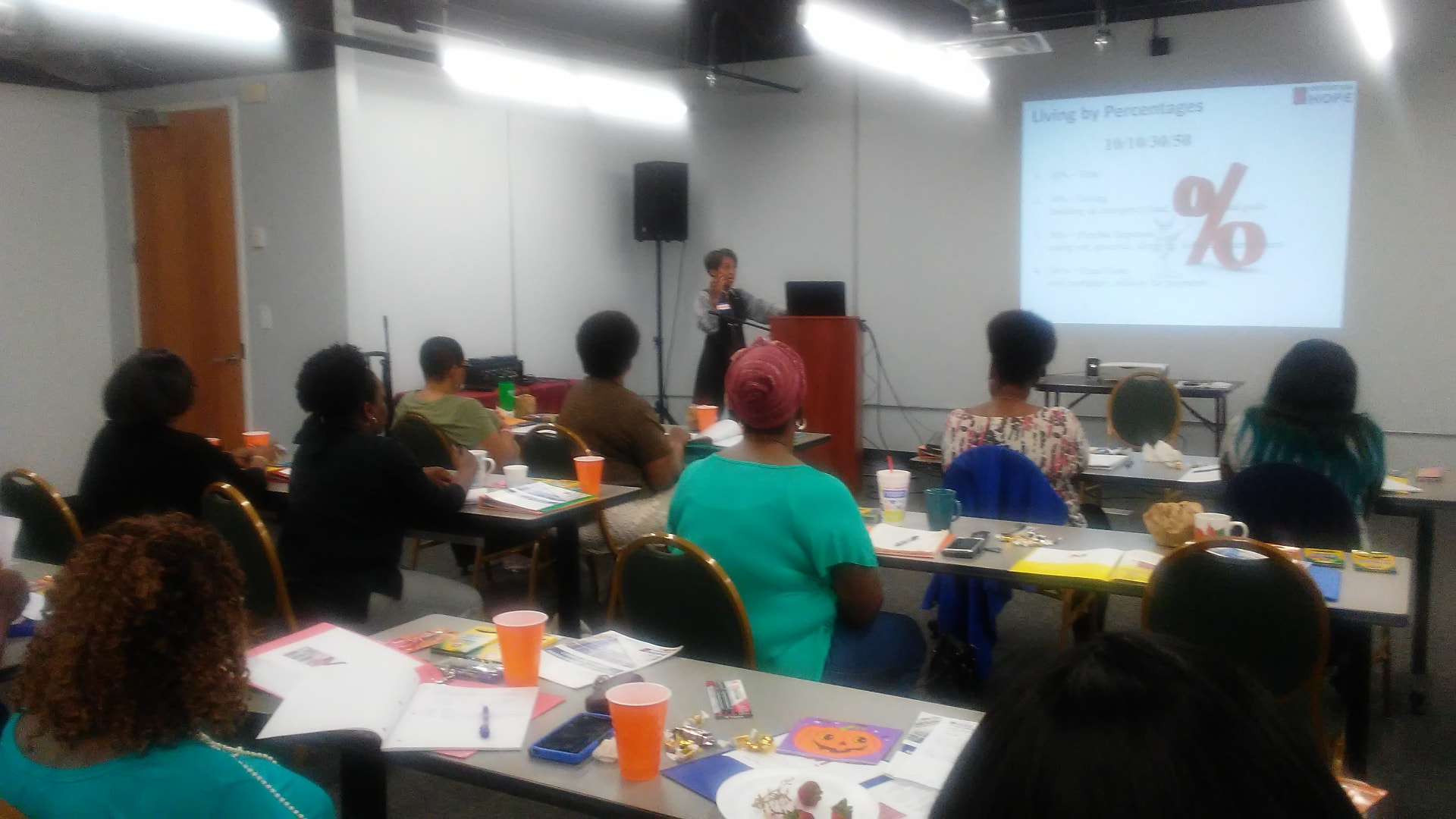 A Money session in progress with a presenter and engaged participants
