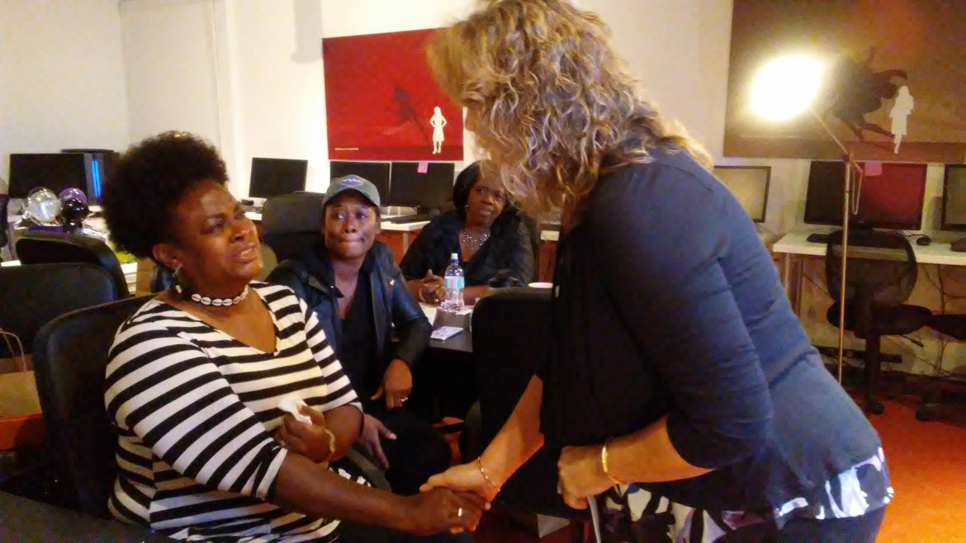 One woman warmly encouraging another during a session